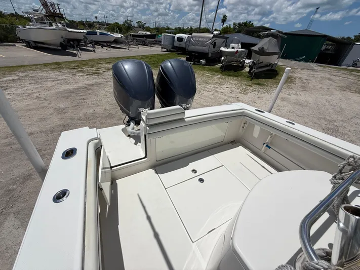  Yacht Photos Pics 2014 Jupiter 30 FS boat with twin outboard engines in a marina setting.