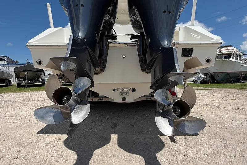  Yacht Photos Pics Rear view of a 2014 Jupiter 30 FS boat with dual outboard motors.