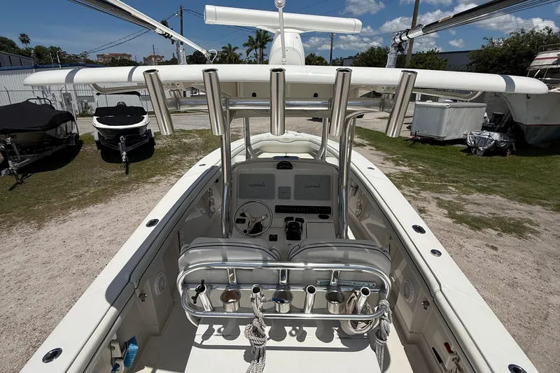  Yacht Photos Pics 2014 Jupiter 30 FS boat interior with helm, rod holders, and Garmin electronics.