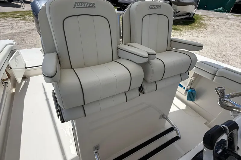  Yacht Photos Pics 2014 Jupiter 30 FS boat seats, white leather, dual armrests, outdoor setting.
