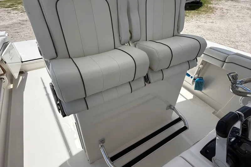  Yacht Photos Pics White leather boat seats on a 2014 Jupiter 30 FS, featuring sleek design and comfort.