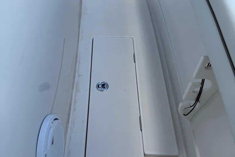  Yacht Photos Pics 2014 Jupiter 30 FS boat deck with storage compartment and speaker.