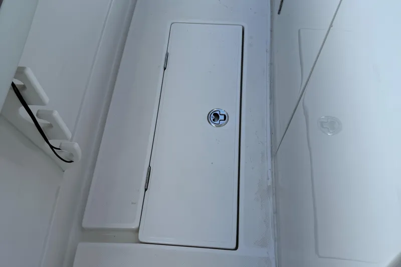  Yacht Photos Pics 2014 Jupiter 30 FS boat storage compartment with secure latch.