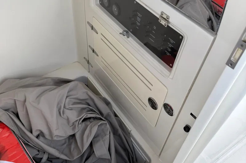  Yacht Photos Pics 2014 Jupiter 30 FS boat interior with control panel and folded fabric.