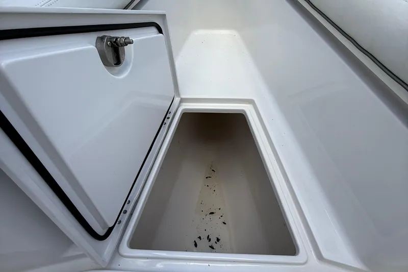  Yacht Photos Pics Open storage compartment on a 2014 Jupiter 30 FS boat, showing interior space.