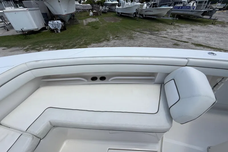  Yacht Photos Pics 2014 Jupiter 30 FS boat interior with white cushioned seating.