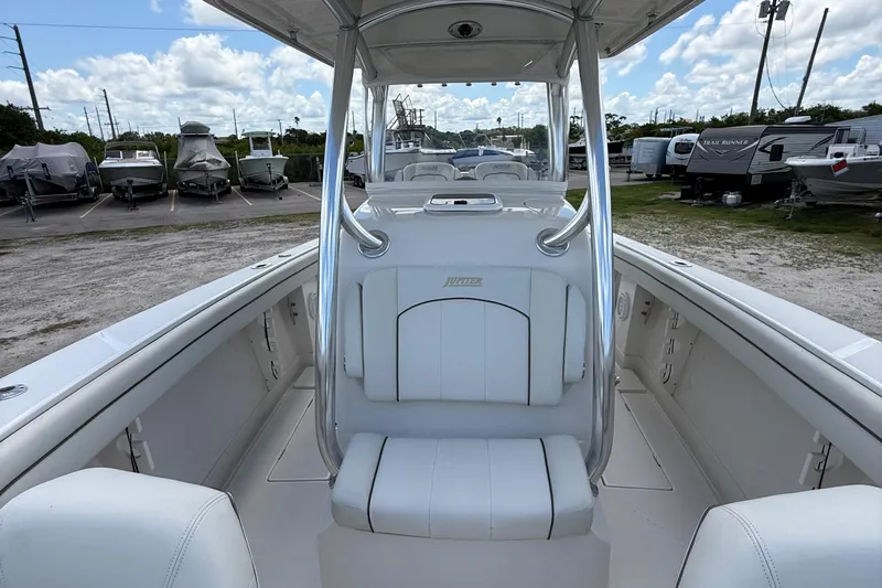  Yacht Photos Pics 2014 Jupiter 30 FS boat interior with white seating, parked among other boats.