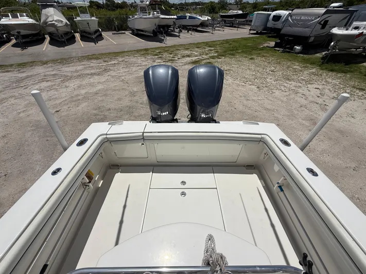  Yacht Photos Pics 2014 Jupiter 30 FS boat with dual engines in a parking area.