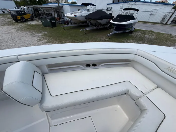  Yacht Photos Pics 2014 Jupiter 30 FS boat interior with white seating, parked near other boats.