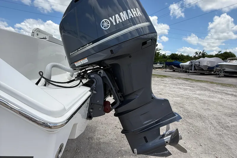  Yacht Photos Pics 2014 Jupiter 30 FS boat with Yamaha four-stroke outboard motor in a marina setting.