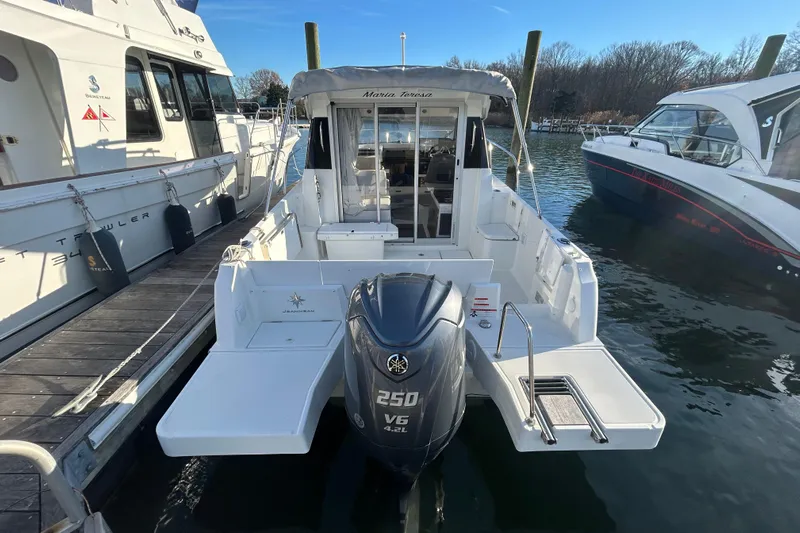  Yacht Photos Pics 2023 Jeanneau NC 795 Series 2 boat docked, featuring a powerful 250 V6 engine.