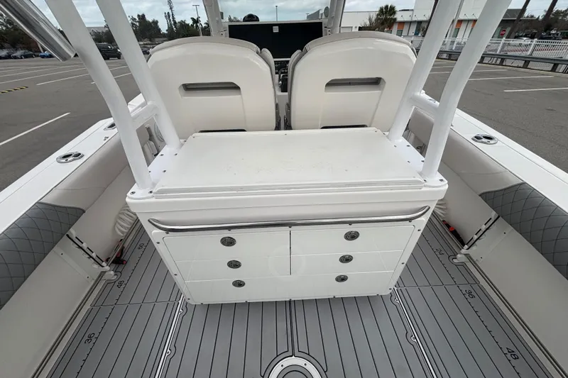 Liberty Call Yacht Photos Pics 2015 Edgewater 320CC boat interior with seating and storage compartments.