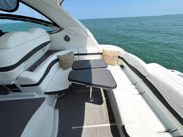  Yacht Photos Pics 2017 Formula 37 Performance Cruiser interior with ocean view, white seating, and dual tables.