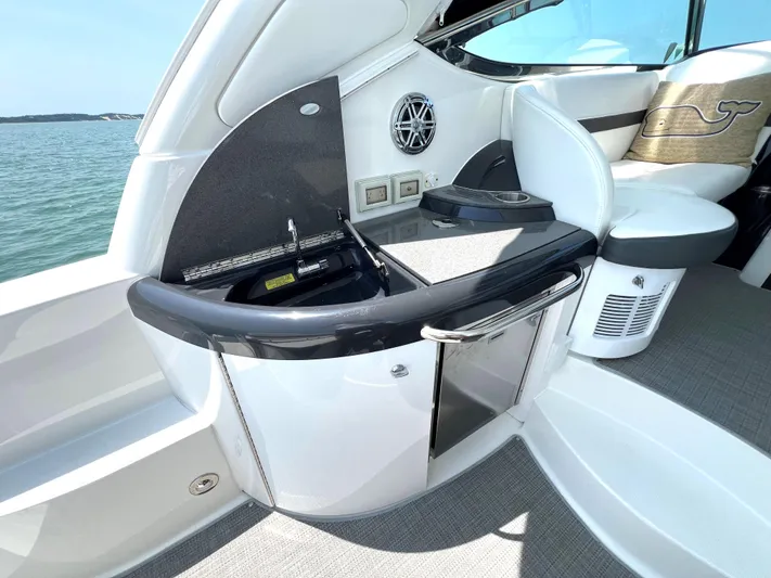  Yacht Photos Pics 2017 Formula 37 Performance Cruiser interior with kitchenette and seating area.
