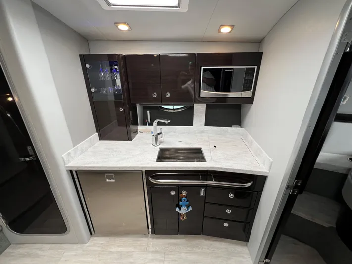  Yacht Photos Pics 2017 Formula 37 Performance Cruiser kitchen with modern appliances and sleek cabinetry.