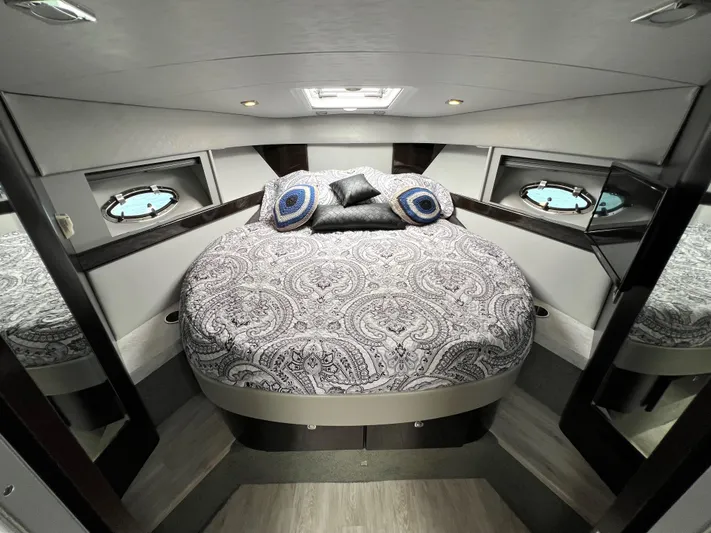  Yacht Photos Pics Luxurious bedroom in 2017 Formula 37 Performance Cruiser with elegant bedding and porthole windows.
