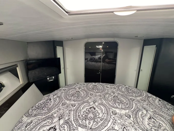 Yacht Photos Pics Interior cabin of 2017 Formula 37 Performance Cruiser with bed and TV.