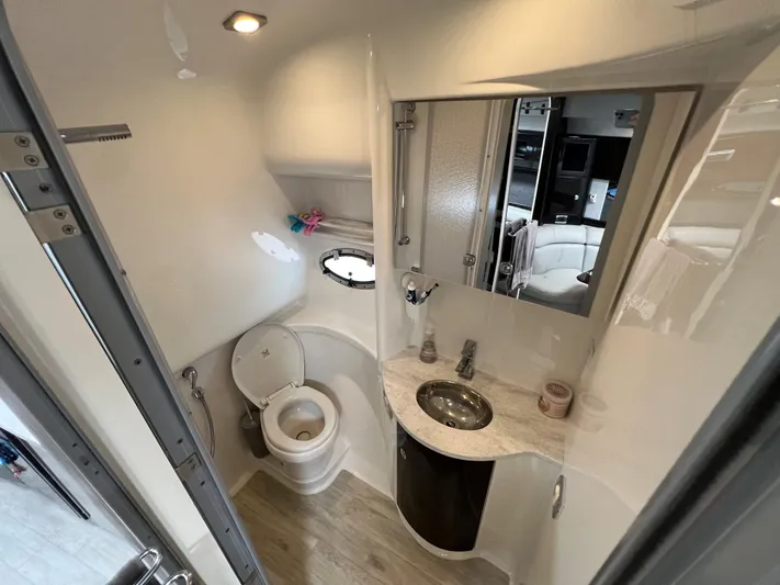  Yacht Photos Pics 2017 Formula 37 Performance Cruiser bathroom with modern fixtures and a sleek design.