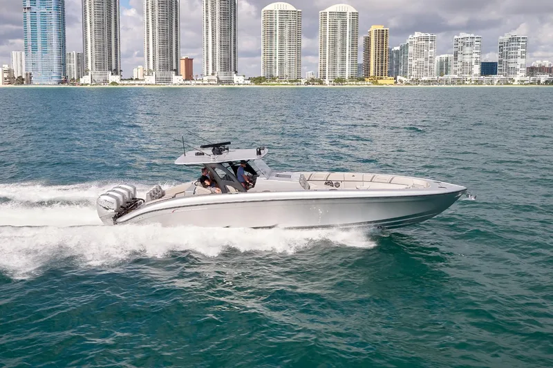  Yacht Photos Pics 2018 Midnight Express 43 Open boat cruising near city skyline.