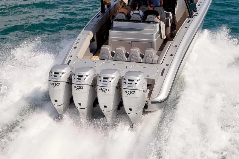  Yacht Photos Pics 2018 Midnight Express 43 Open boat with four powerful outboard engines cruising on water.