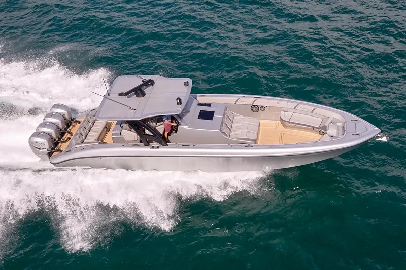  Yacht Photos Pics 2018 Midnight Express 43 Open boat cruising on the ocean with four engines.