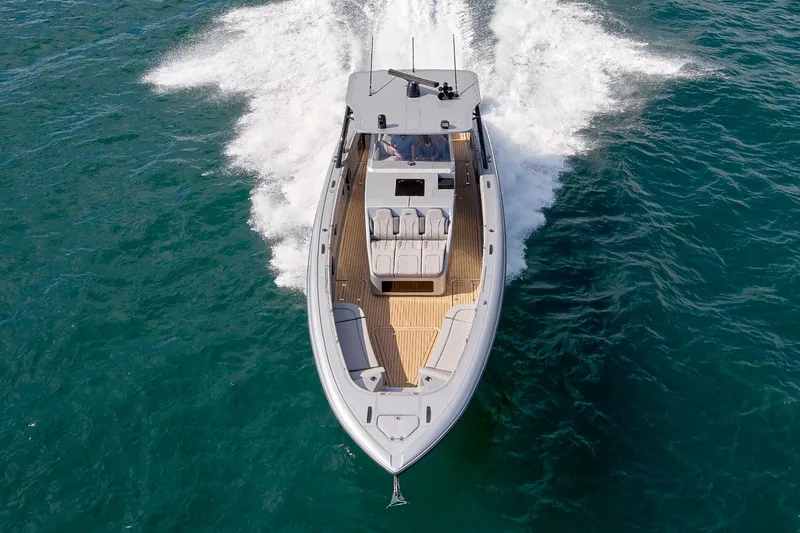  Yacht Photos Pics 2018 Midnight Express 43 Open boat cruising on open water, aerial view.