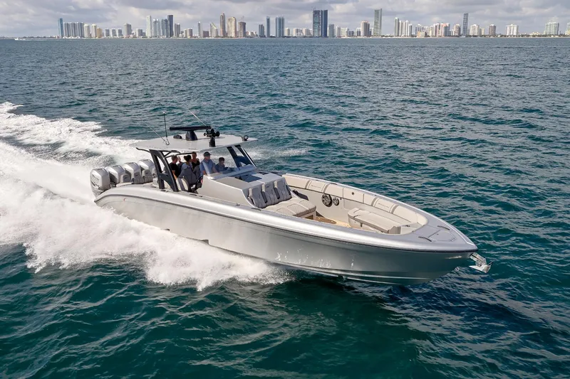  Yacht Photos Pics 2018 Midnight Express 43 Open boat cruising on ocean with city skyline in background.