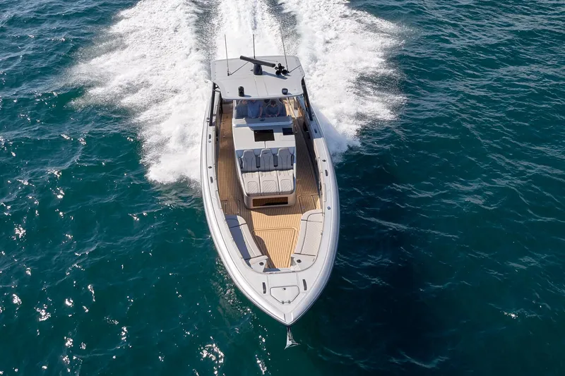 Yacht Photos Pics 2018 Midnight Express 43 Open yacht cruising on open water, aerial view.