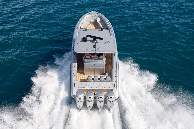  Yacht Photos Pics 2018 Midnight Express 43 Open boat cruising on open water, rear view.