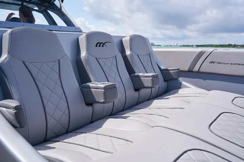  Yacht Photos Pics Luxurious seating on 2018 Midnight Express 43 Open boat with quilted gray upholstery.