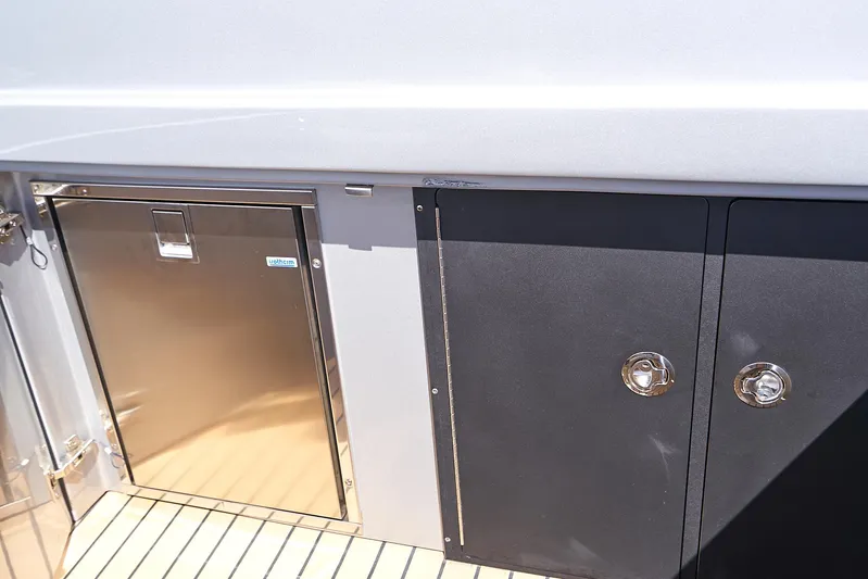  Yacht Photos Pics 2018 Midnight Express 43 Open yacht storage compartments and stainless steel door.
