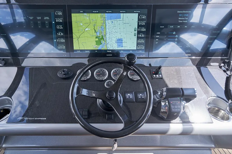  Yacht Photos Pics 2018 Midnight Express 43 Open helm with navigation screens and controls.
