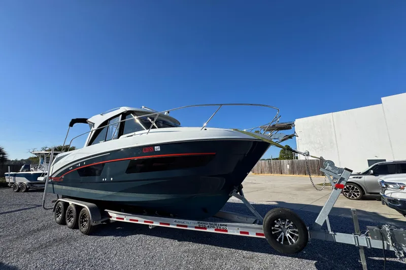  Yacht Photos Pics 2020 Beneteau Antares 27 boat on trailer under clear blue sky.