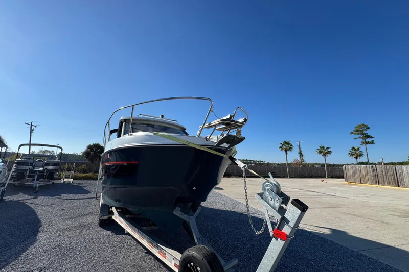  Yacht Photos Pics 2020 Beneteau Antares 27 boat on trailer under clear blue sky.