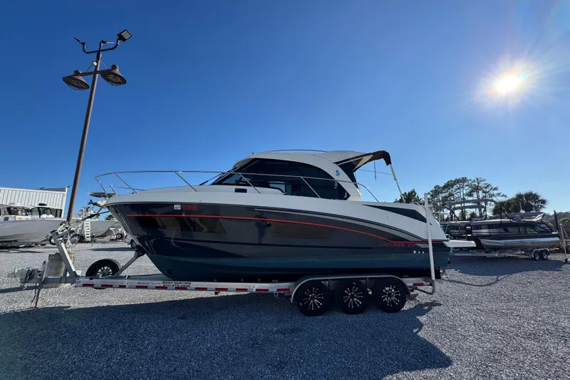  Yacht Photos Pics 2020 Beneteau Antares 27 boat on trailer under clear blue sky.