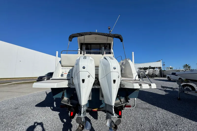  Yacht Photos Pics 2020 Beneteau Antares 27 boat with dual outboard engines, docked outdoors.