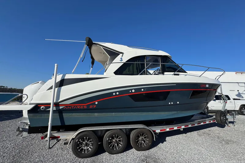  Yacht Photos Pics 2020 Beneteau Antares 27 boat on trailer under clear blue sky.