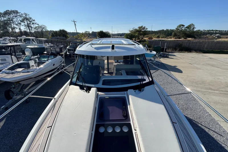  Yacht Photos Pics 2020 Beneteau Antares 27 boat on display in a marina setting.