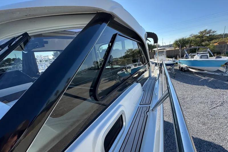  Yacht Photos Pics 2020 Beneteau Antares 27 boat side view with sleek design and railing.