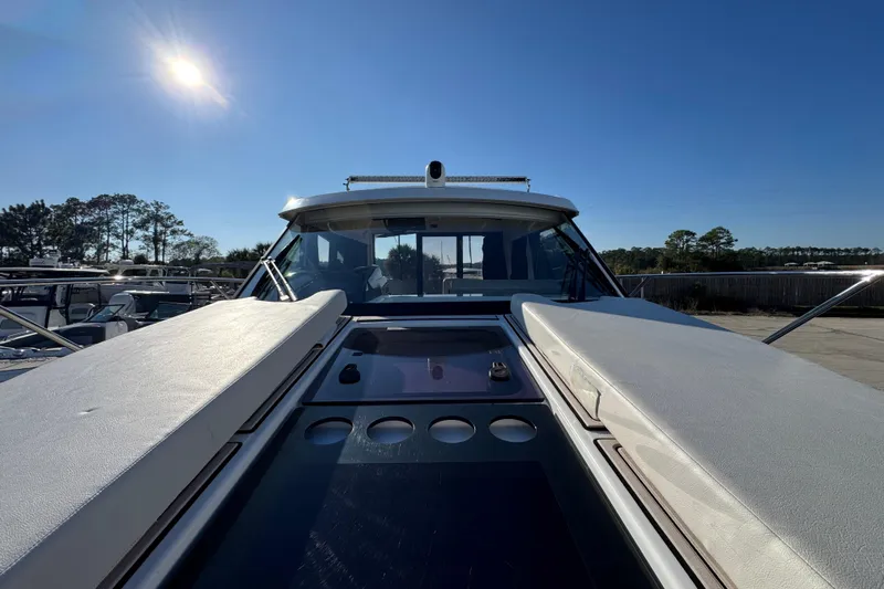  Yacht Photos Pics 2020 Beneteau Antares 27 boat under clear blue sky, showcasing sleek design and spacious deck.