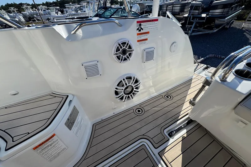  Yacht Photos Pics 2020 Beneteau Antares 27 boat deck with speakers and warning labels.