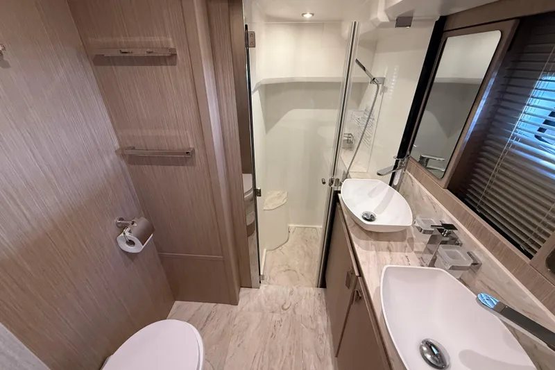 Ava Hana Yacht Photos Pics Luxurious bathroom in 2024 Prestige F4.9 yacht with modern fixtures and elegant design.