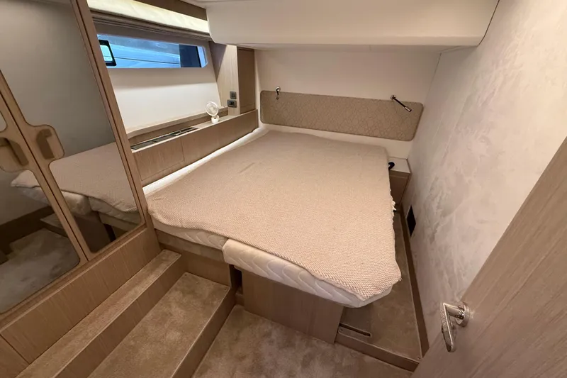 Ava Hana Yacht Photos Pics 2024 Prestige F4.9 yacht cabin with cozy bed, wooden accents, and modern design.
