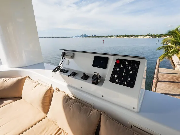  Yacht Photos Pics Control panel on luxury Arkup 50 yacht, overlooking serene waterfront view.
