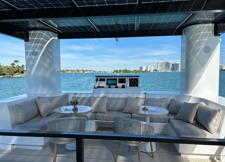  Yacht Photos Pics Luxurious seating area on Arkup 50 houseboat with waterfront view, 2025 model.