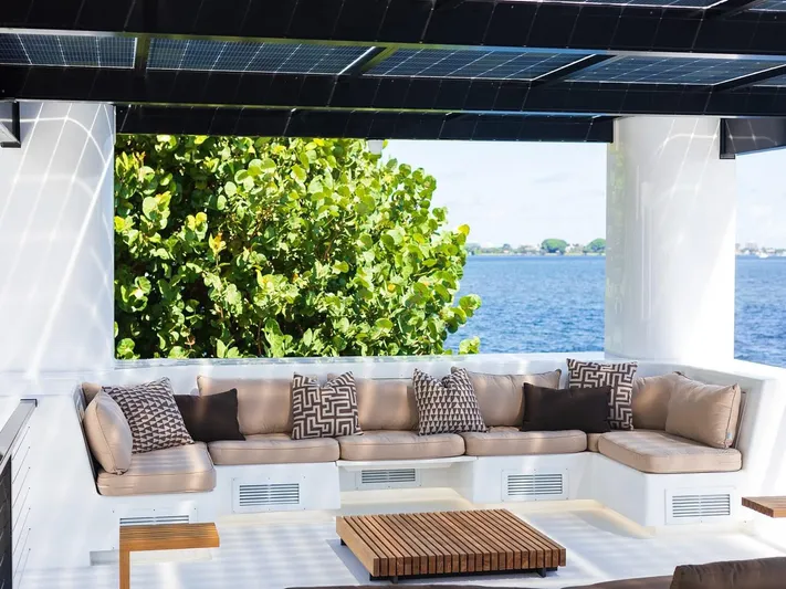  Yacht Photos Pics Luxurious outdoor seating on Arkup 50 houseboat, featuring modern cushions and waterfront view.