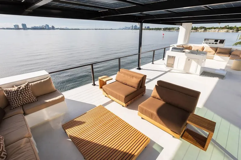  Yacht Photos Pics Luxurious Arkup 50 yacht deck with modern seating, overlooking serene waterfront views.