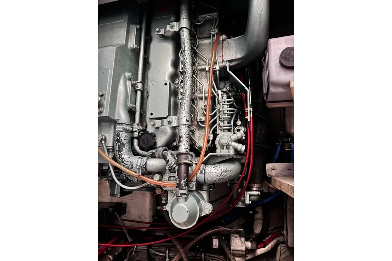  Yacht Photos Pics Engine of 1989 Bayliner 4588 Pilothouse boat, detailed view with pipes and components.