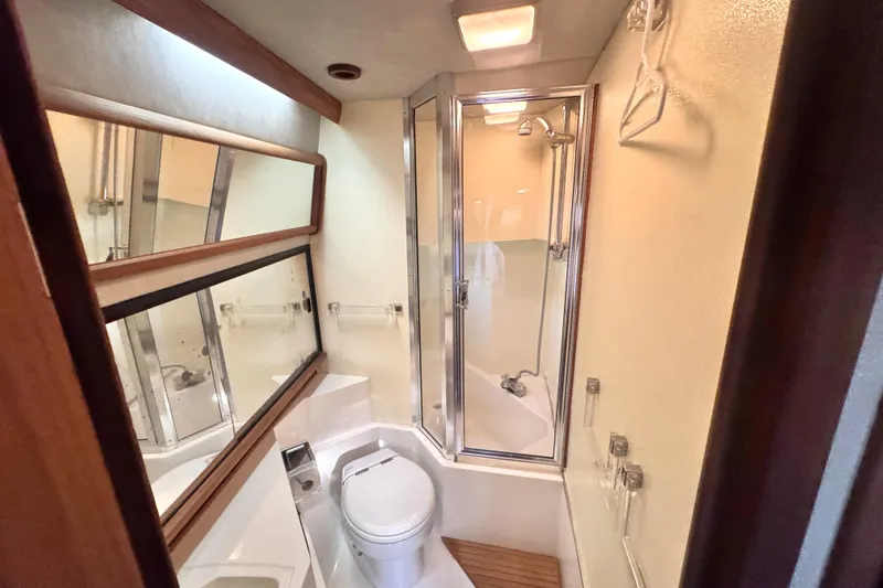  Yacht Photos Pics Bathroom interior of 1989 Bayliner 4588 Pilothouse with shower and toilet.
