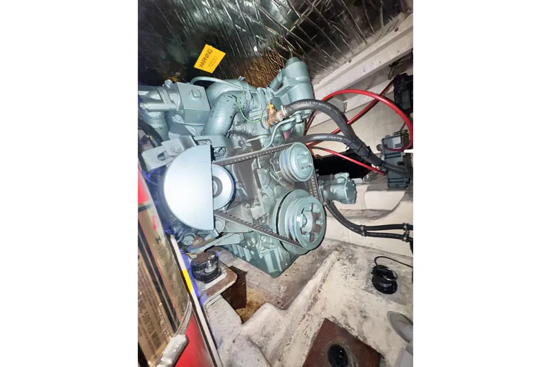  Yacht Photos Pics Engine compartment of 1989 Bayliner 4588 Pilothouse with visible belts and wiring.